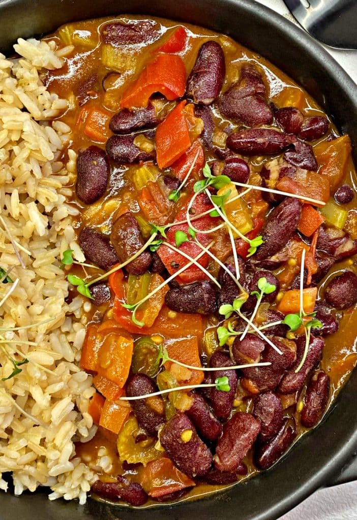 Red beans and rice garnished with greens