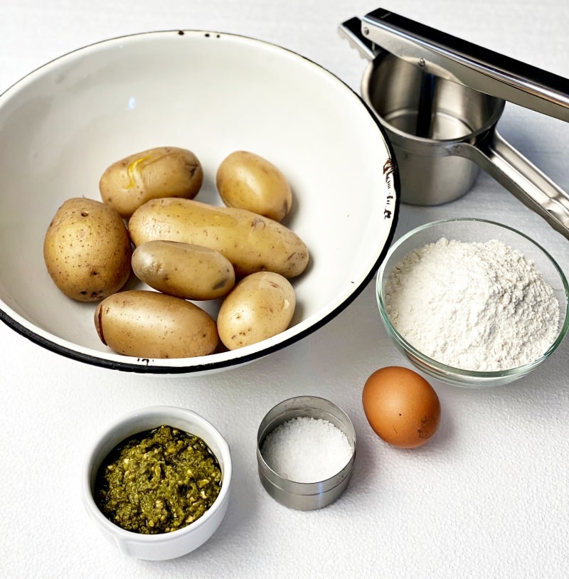 potato ricer, boiled potatoes with eg flour salt and pesto sauce