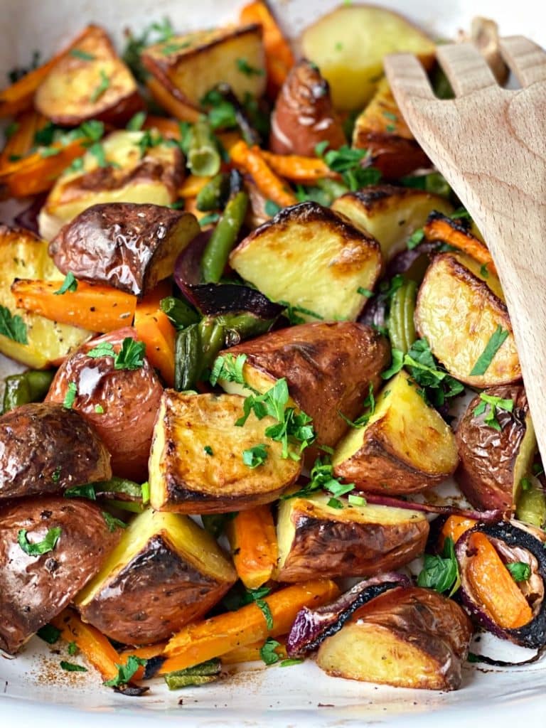  Roasted Garlic Potatoes with green beans and carrots in the oven