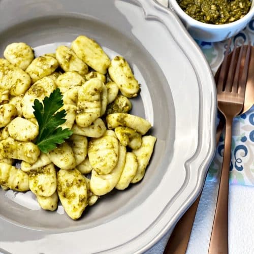 plate with homemade gnocchi with pesto sauce