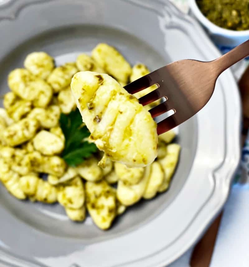 homemake gnocchi with pesto on fork