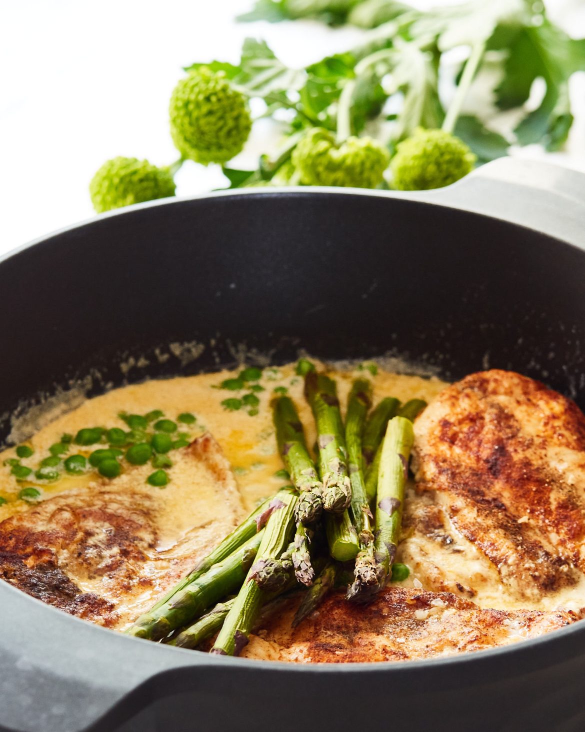 chicken breast in creamy truffle sauce with asparagus