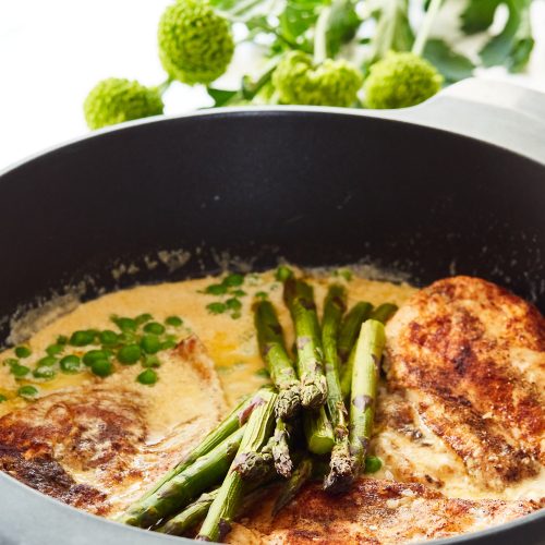 chicken breast in creamy truffle sauce with asparagus